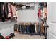 This walk-in closet is fully stocked with organized racks and shelving at 11684 Stovall Place Pl, Hampton, GA 30228