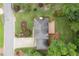 This aerial view showcases the home's roof, a charming deck, lush lawn, and meticulously landscaped garden at 1338 Nonie Way, Marietta, GA 30062
