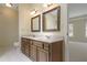 Dual vanity bathroom showcasing matching mirrors and traditional cabinets at 1338 Nonie Way, Marietta, GA 30062