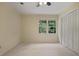 Bright bedroom with large window, neutral carpet, and closet for ample storage space at 1338 Nonie Way, Marietta, GA 30062