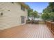 Spacious wooden deck with railing offers a great outdoor space for entertaining, connecting to home with double doors at 1338 Nonie Way, Marietta, GA 30062
