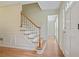 Bright foyer featuring hardwood floors, staircase, and paneled front door at 1338 Nonie Way, Marietta, GA 30062