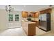 Functional kitchen with stainless steel appliances and access to outdoor deck at 1338 Nonie Way, Marietta, GA 30062
