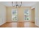 Large living room featuring hardwood floors, crown molding, and neutral paint at 1338 Nonie Way, Marietta, GA 30062