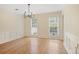 Large living room featuring hardwood floors, crown molding, and neutral paint at 1338 Nonie Way, Marietta, GA 30062
