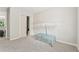 Neutral bedroom featuring a closet, wall fixtures, and a glass-topped coffee table at 3015 Cranbrook Nw Walk, Kennesaw, GA 30144