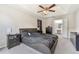 Primary bedroom featuring a trey ceiling, a ceiling fan, and access to the ensuite bathroom at 3015 Cranbrook Nw Walk, Kennesaw, GA 30144
