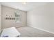 Empty bedroom space with neutral carpet and wall fixtures at 3015 Cranbrook Nw Walk, Kennesaw, GA 30144