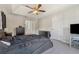Primary bedroom featuring a trey ceiling, a ceiling fan, and access to the ensuite bathroom at 3015 Cranbrook Nw Walk, Kennesaw, GA 30144