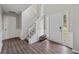 Bright foyer boasts wood-look floors, stairs to upper level and a white front door with sidelights at 3015 Cranbrook Nw Walk, Kennesaw, GA 30144