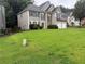 Charming two-story home with neutral siding, stone accents, and an attached two car garage at 3015 Cranbrook Nw Walk, Kennesaw, GA 30144