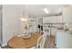 Eat-in kitchen features white cabinetry, granite countertops, and stainless steel appliances at 3015 Cranbrook Nw Walk, Kennesaw, GA 30144