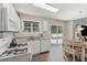 Bright kitchen with granite counters, modern appliances, and sliding door to a deck at 3015 Cranbrook Nw Walk, Kennesaw, GA 30144