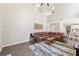 Spacious living room with wood-look flooring, stylish rug, and comfortable seating, adjacent to a dining area at 3015 Cranbrook Nw Walk, Kennesaw, GA 30144