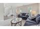 Cozy living room with sofas, hardwood floors, and plenty of natural light at 3015 Cranbrook Nw Walk, Kennesaw, GA 30144