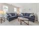 Cozy living room featuring two plush sofas and a glass coffee table, perfect for relaxing and entertaining at 3015 Cranbrook Nw Walk, Kennesaw, GA 30144