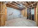 Unfinished basement showcasing wood frame structure and concrete flooring at 307 Cabinwood Trl, Canton, GA 30115