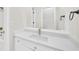 Bright bathroom features updated fixtures, white cabinets, and a large mirror at 307 Cabinwood Trl, Canton, GA 30115