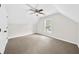 Spacious bedroom with neutral carpet, ceiling fan, and natural light at 307 Cabinwood Trl, Canton, GA 30115