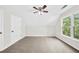 Cozy carpeted bedroom featuring vaulted ceilings, neutral walls, and an abundance of natural light at 307 Cabinwood Trl, Canton, GA 30115