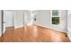 Bright bedroom with hardwood floors, neutral paint, and natural light from two large windows at 307 Cabinwood Trl, Canton, GA 30115