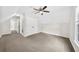 Bright bedroom with carpet flooring, ceiling fan, and large closet at 307 Cabinwood Trl, Canton, GA 30115