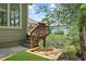 Wooden deck with steps surrounded by lush landscaping at 307 Cabinwood Trl, Canton, GA 30115