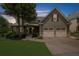 Charming home with a two-car garage, well-manicured lawn, and inviting front porch against a dusk sky at 307 Cabinwood Trl, Canton, GA 30115