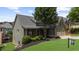 Inviting two-story home with well-manicured lawn, attached two-car garage and a 'coming soon' sign at 307 Cabinwood Trl, Canton, GA 30115