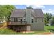 Exterior elevation of home with wooden deck and backyard at 307 Cabinwood Trl, Canton, GA 30115