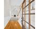 Entryway showcases hardwood floors, a staircase, and a view into the living room with vaulted ceilings at 307 Cabinwood Trl, Canton, GA 30115