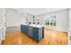 Spacious kitchen featuring a center island, stainless steel appliances, and hardwood floors with an open layout at 307 Cabinwood Trl, Canton, GA 30115