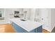 Beautiful kitchen with a large island, quartz countertops, stainless steel appliances and hardwood floors at 307 Cabinwood Trl, Canton, GA 30115