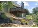 Beautiful tiered landscaping leads up to the home's deck in the backyard at 307 Cabinwood Trl, Canton, GA 30115