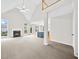 Bright living room with a fireplace, vaulted ceilings, and large windows allowing natural light to flood in at 307 Cabinwood Trl, Canton, GA 30115