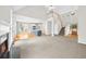 Open-concept floorplan with views of the kitchen, living room with fireplace and stairway to the upper level at 307 Cabinwood Trl, Canton, GA 30115