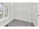 Well organized walk-in closet with shelving and a window providing natural light at 307 Cabinwood Trl, Canton, GA 30115