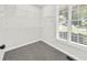 Walk-in closet with carpet, metal shelving, and large windows letting in natural light at 307 Cabinwood Trl, Canton, GA 30115