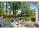 Inviting outdoor deck with wooden railings, outdoor seating, and a lush backyard perfect for relaxation at 3242 Monarch Pine Dr, Peachtree Corners, GA 30071