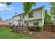 Green backyard with a wooden deck and privacy fence at 3242 Monarch Pine Dr, Peachtree Corners, GA 30071