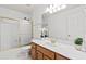 Bright bathroom featuring a shower/tub combination and double sinks at 3242 Monarch Pine Dr, Peachtree Corners, GA 30071