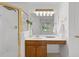 Bright bathroom features a shower, wooden vanity, and neutral decor at 3242 Monarch Pine Dr, Peachtree Corners, GA 30071