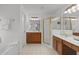 Spacious bathroom with double vanity sinks, a corner glass enclosed shower, and a soaking tub at 3242 Monarch Pine Dr, Peachtree Corners, GA 30071