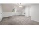 Carpeted bonus room with a window and built-in shelves at 3242 Monarch Pine Dr, Peachtree Corners, GA 30071