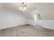 The bonus room is carpeted with a window for natural light at 3242 Monarch Pine Dr, Peachtree Corners, GA 30071