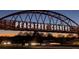 Night view of the Peachtree Corners bridge showcasing a modern design and pedestrian walkway at 3242 Monarch Pine Dr, Peachtree Corners, GA 30071