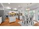 Bright kitchen with an island, stainless steel appliances, and an adjacent breakfast nook at 3242 Monarch Pine Dr, Peachtree Corners, GA 30071
