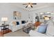 Comfortable living room with fireplace and hardwood floors that open to the kitchen at 3242 Monarch Pine Dr, Peachtree Corners, GA 30071