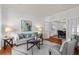 Comfortable living room with large windows and an open doorway that provides access to the dining area at 3242 Monarch Pine Dr, Peachtree Corners, GA 30071
