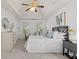Bright main bedroom features tray ceilings, soft carpet, and a large picture window at 3242 Monarch Pine Dr, Peachtree Corners, GA 30071